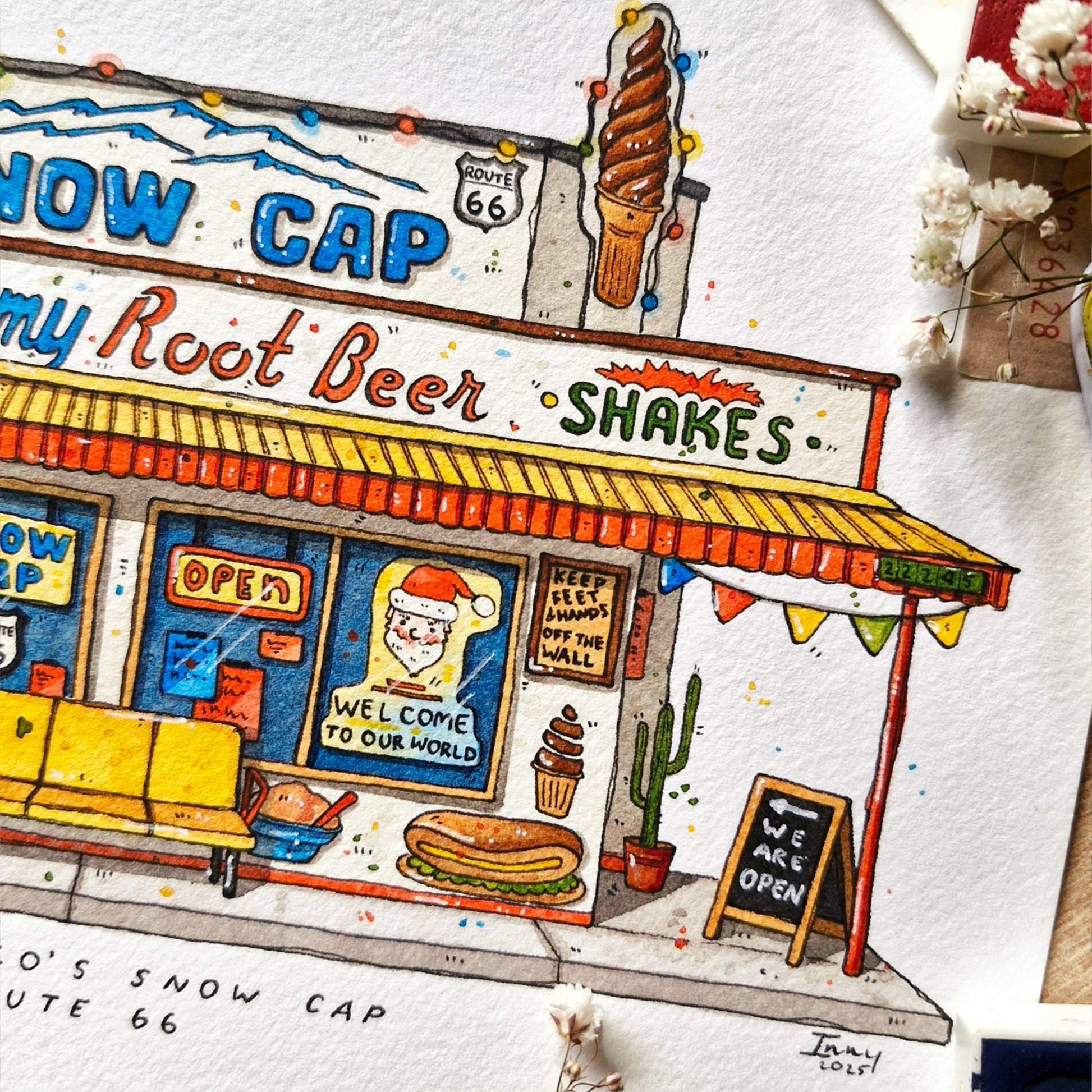 Illustration of a vintage-style ice cream shop with colorful sign and details on route 66